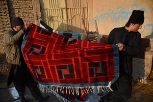 Red handwoven Afghan wool rug